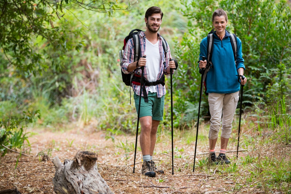 Couple hiking through a forest in the countryside-1